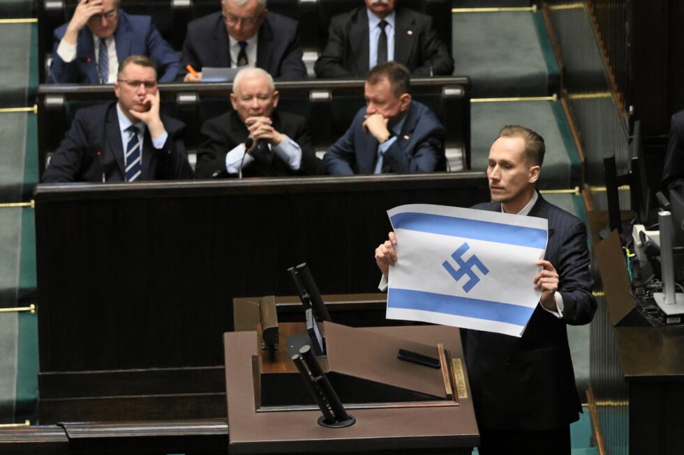 Polish MP Sparks Outrage After Displaying Israeli Flag with Swastika in Parliament