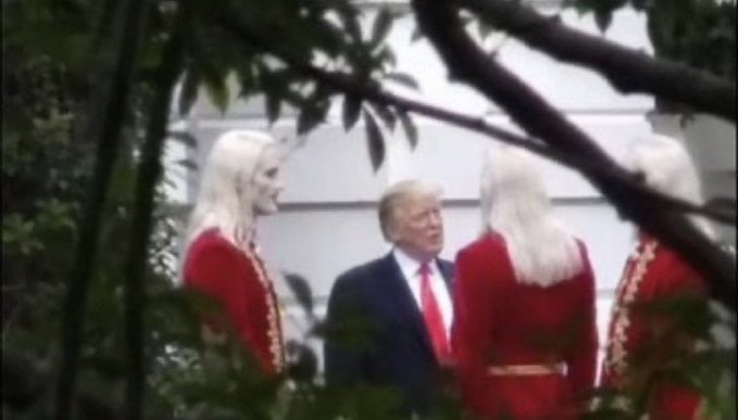 Viral ‘Deleted’ Trump Photo With Red-Coated Group Is AI Hoax